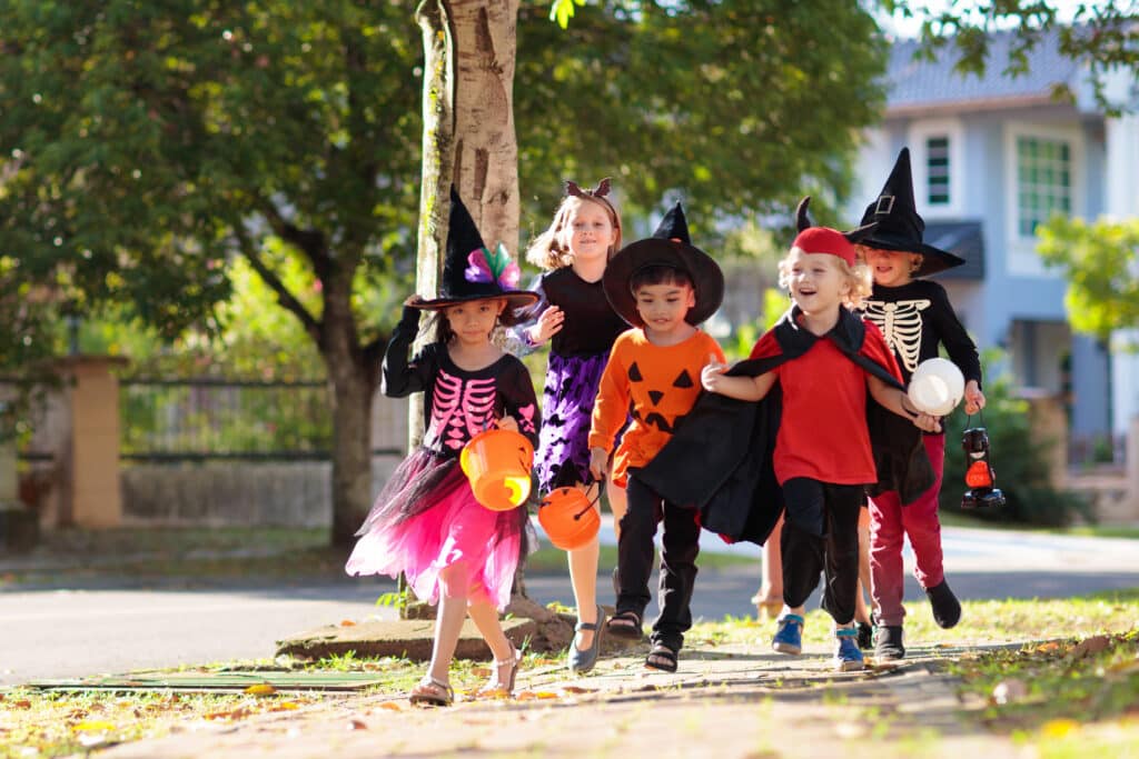 Kids trick or treat. Halloween fun for children.